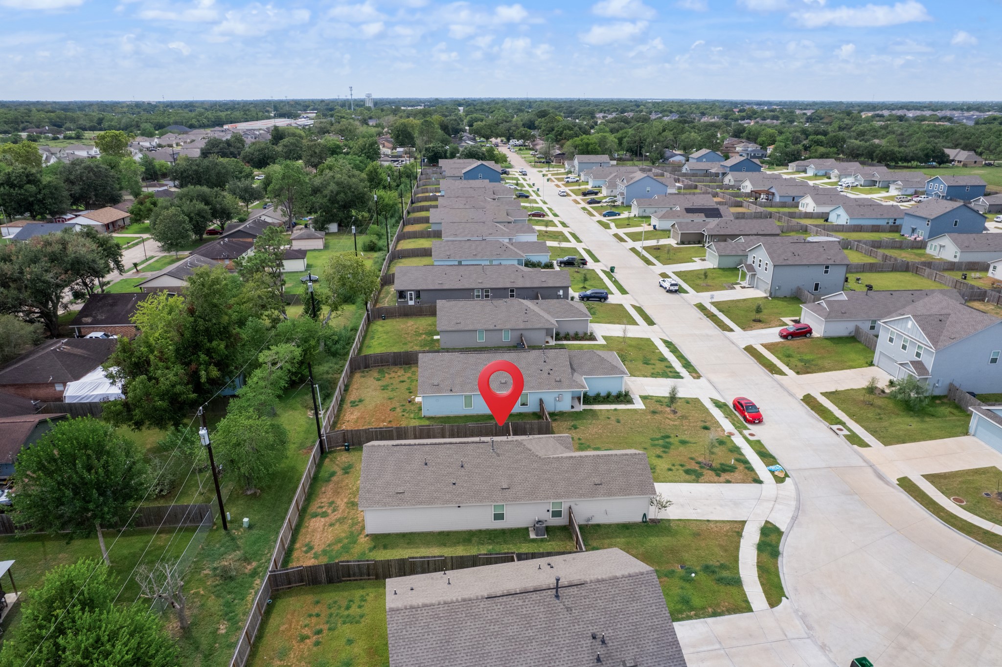 252 Houston Street Angleton, TX 77515 - Photo 49 of 49 Closer aerial perspective highlights the property and its fenced backyard while showing the surrounding streets and neighboring homes.
