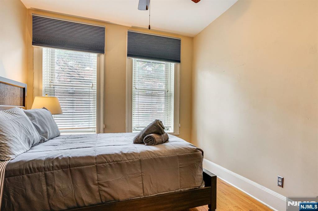 608 Madison Street, Unit 2 Hoboken, NJ 07030 - Photo 14 of 24 a bedroom with a bed and a window