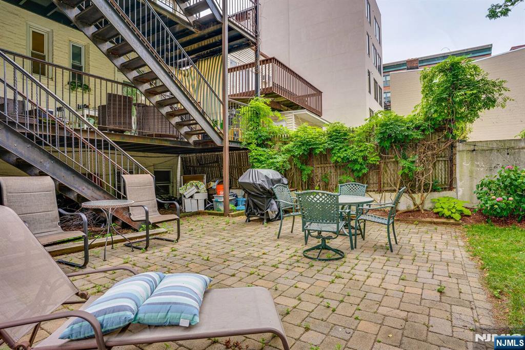 608 Madison Street, Unit 2 Hoboken, NJ 07030 - Photo 16 of 24 a view of a house with backyard and sitting area