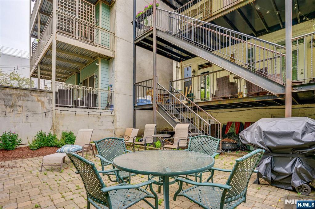 608 Madison Street, Unit 2 Hoboken, NJ 07030 - Photo 19 of 24 a balcony with table and chairs