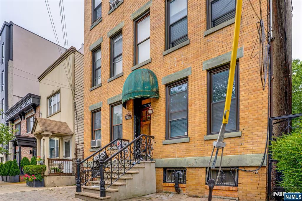 608 Madison Street, Unit 2 Hoboken, NJ 07030 - Photo 22 of 24 a view of a building with a street