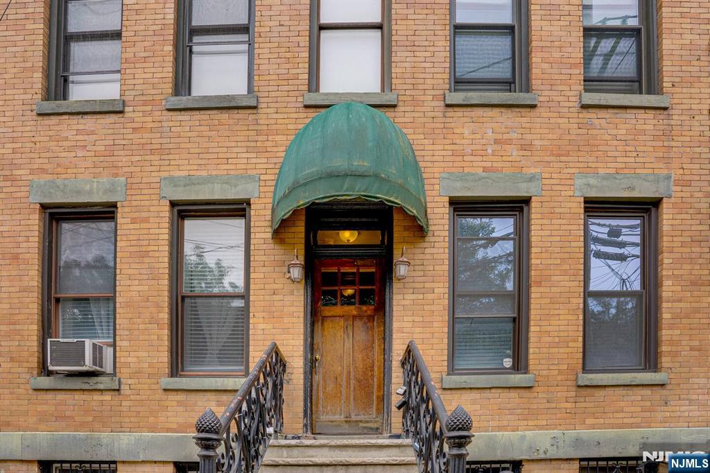 608 Madison Street, Unit 2 Hoboken, NJ 07030 - Photo 24 of 24 a brick house with large windows