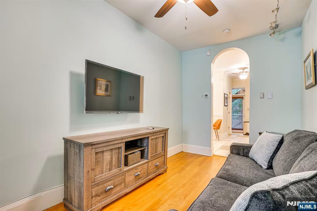 608 Madison Street, Unit 2 Hoboken, NJ 07030 - Photo 4 of 24 a living room with furniture and a fireplace