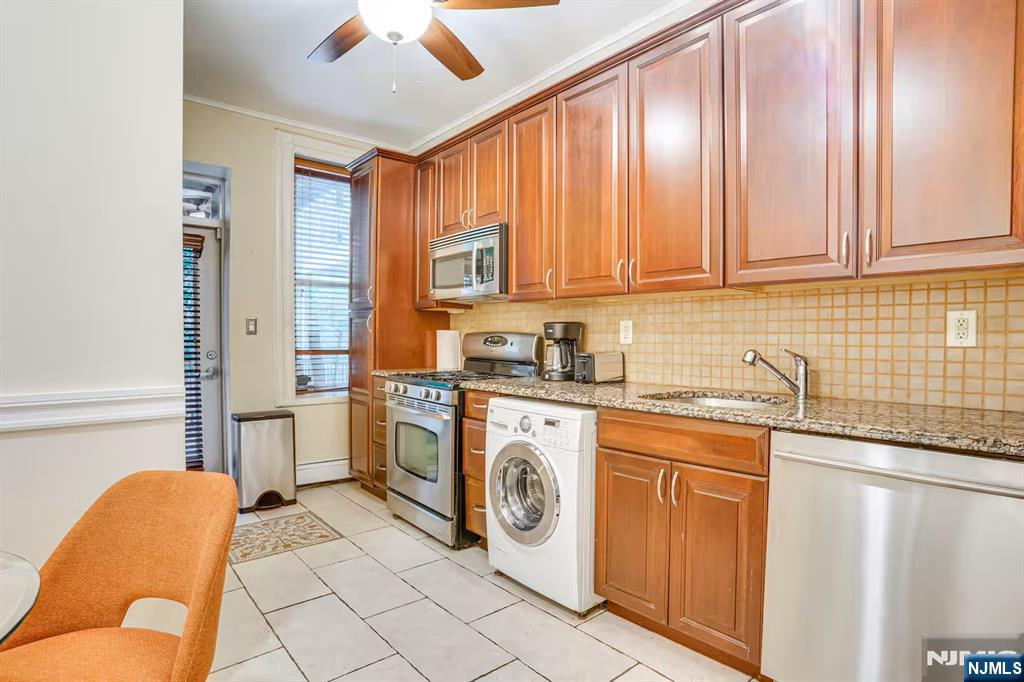 608 Madison Street, Unit 2 Hoboken, NJ 07030 - Photo 5 of 24 a utility room with stainless steel appliances granite countertop a sink and a cabinets