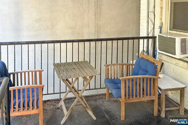 a view of a porch with wooden floor