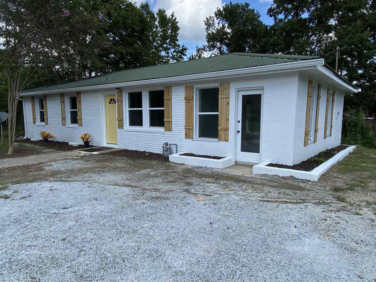 1554 Cromer Road Elberton, GA 30635 - Photo 1 of 1 a house with trees in the background