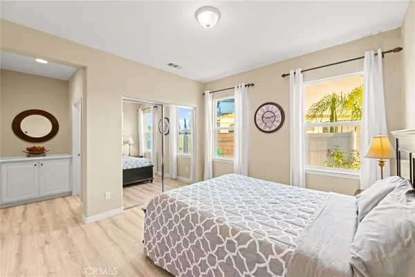 a bedroom with a bed and a window