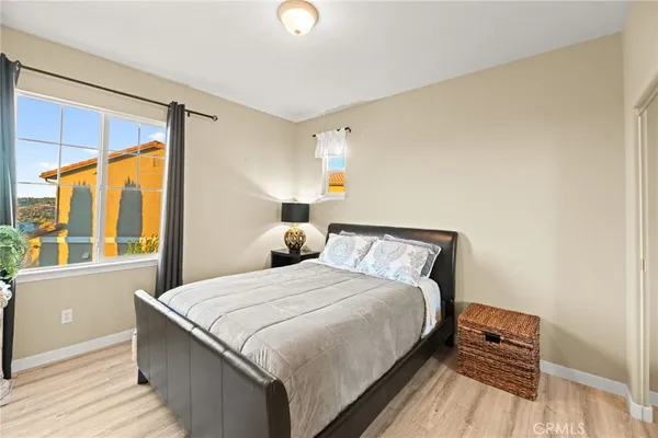 a bedroom with a bed and a window