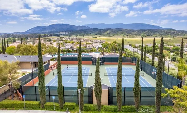 an aerial view of residential houses and outdoor space
