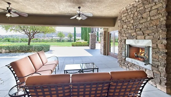 a view of a swimming pool with a yard and lake view