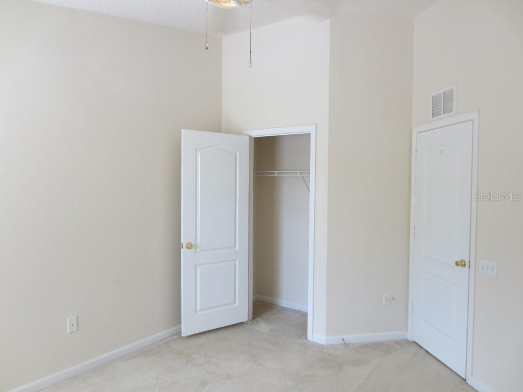 1038 Vista Cay Court Brandon, FL 33511 - Photo 11 of 13 an empty room with closet
