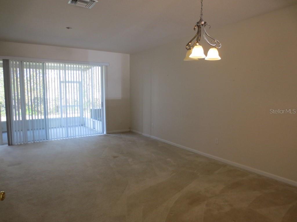 1038 Vista Cay Court Brandon, FL 33511 - Photo 3 of 13 a view of an empty room with a window