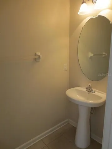 a bathroom with a sink and mirror