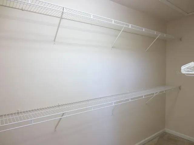 a view of a room with racks on the wall