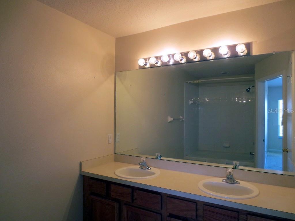 1038 Vista Cay Court Brandon, FL 33511 - Photo 9 of 13 a bathroom with a sink and a mirror