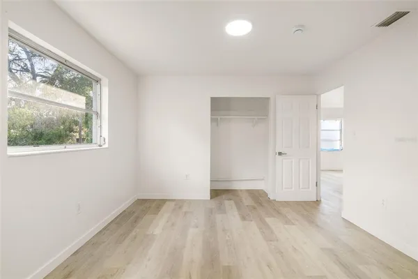 a view of an empty room with a window