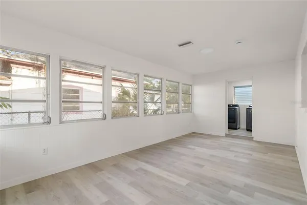 a view of an empty room with a window