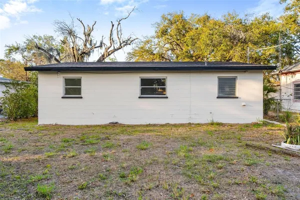 a house view with a backyard space