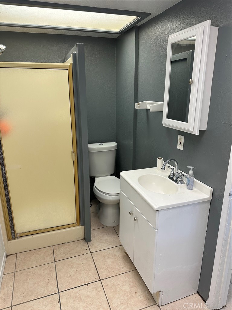 1380 Indian Sage Road Lancaster, CA 93534 - Photo 16 of 24 a bathroom with a sink a toilet and mirror