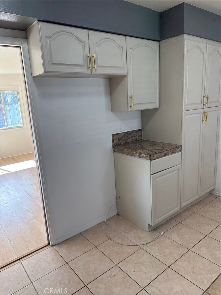 1380 Indian Sage Road Lancaster, CA 93534 - Photo 18 of 24 a utility room with cabinets washer and dryer
