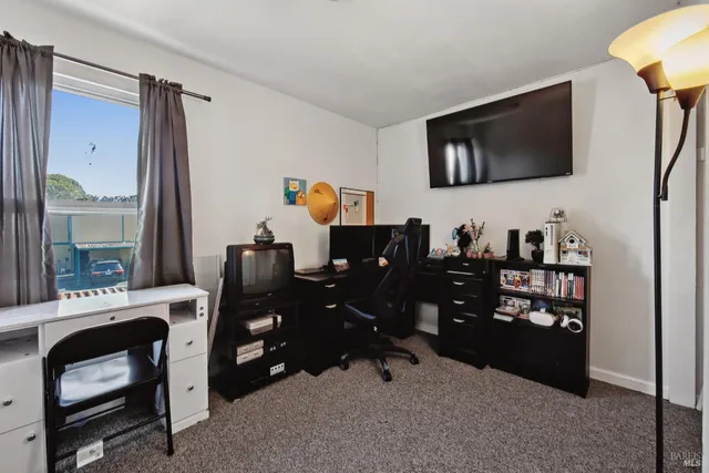 a view of a workspace with furniture