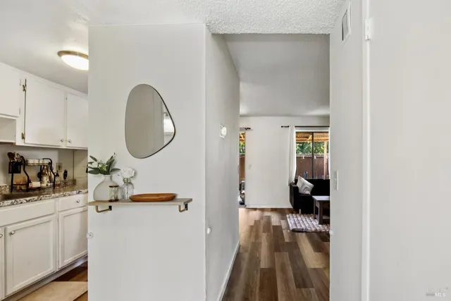 a kitchen with stainless steel appliances granite countertop a sink and cabinets
