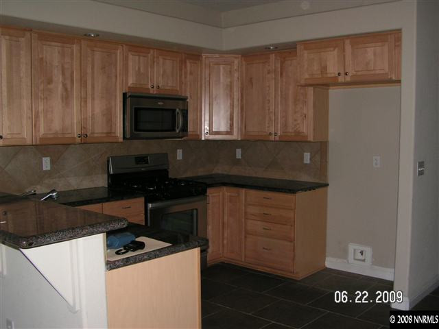 1950 Dickerson Road Reno, NV 89503 - Photo 2 of 7 a kitchen with a sink and a stove top oven