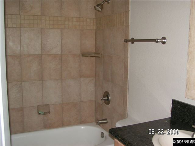 1950 Dickerson Road Reno, NV 89503 - Photo 5 of 7 a bathroom with a sink and a shower