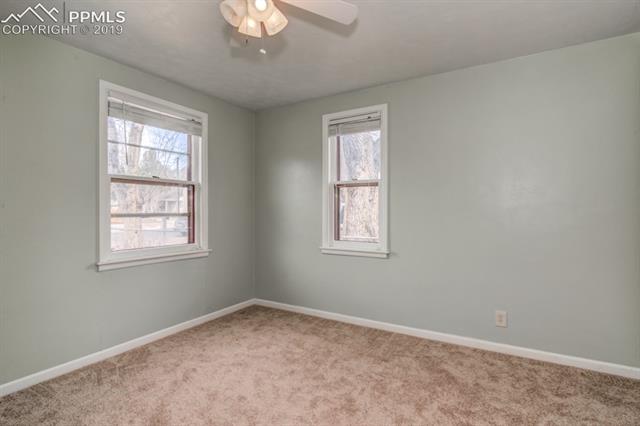 611 Prairie Road Colorado Springs, CO 80909 - Photo 9 of 18 Brand new carpet and padding installed.