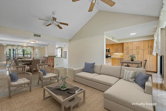 an aerial view of house with yard swimming pool and ocean view