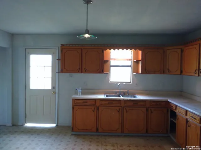 a view of a hallway with a shower