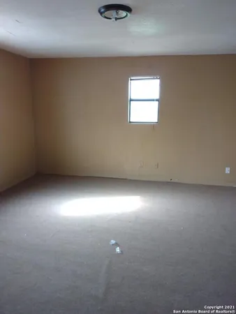 an empty room and window