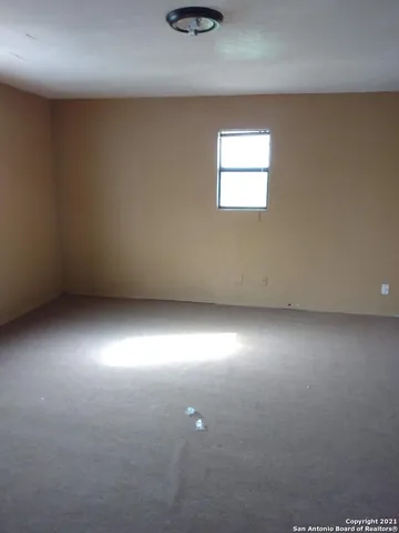 an empty room and window