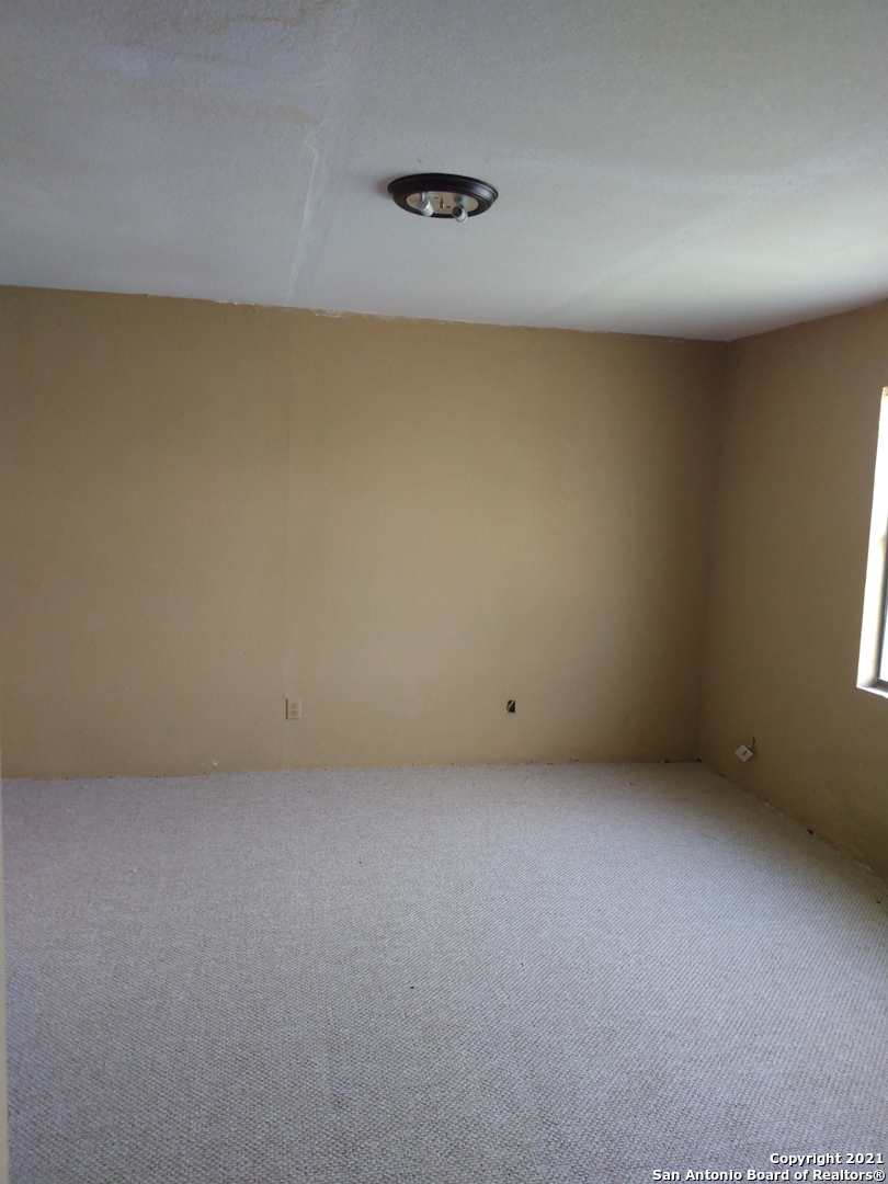 818 Austin Street Asherton, TX 78827 - Photo 7 of 15 a view of a room