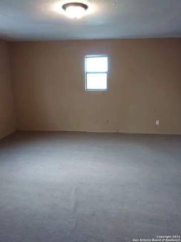 a kitchen with sink cabinets and window