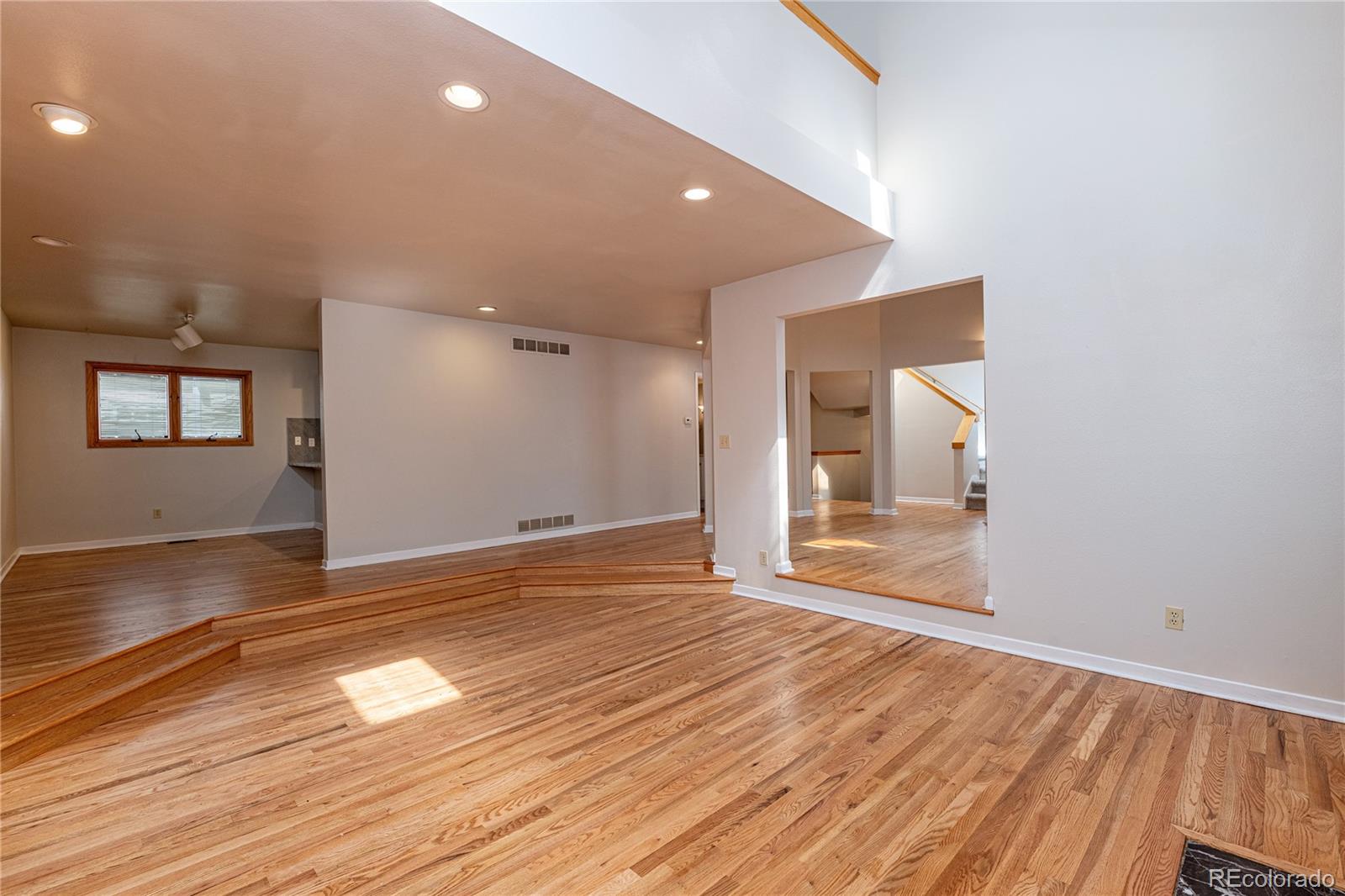 541 Monroe Street, Unit B Denver, CO 80206 - Photo 12 of 37 a view of empty room with wooden floor and fan
