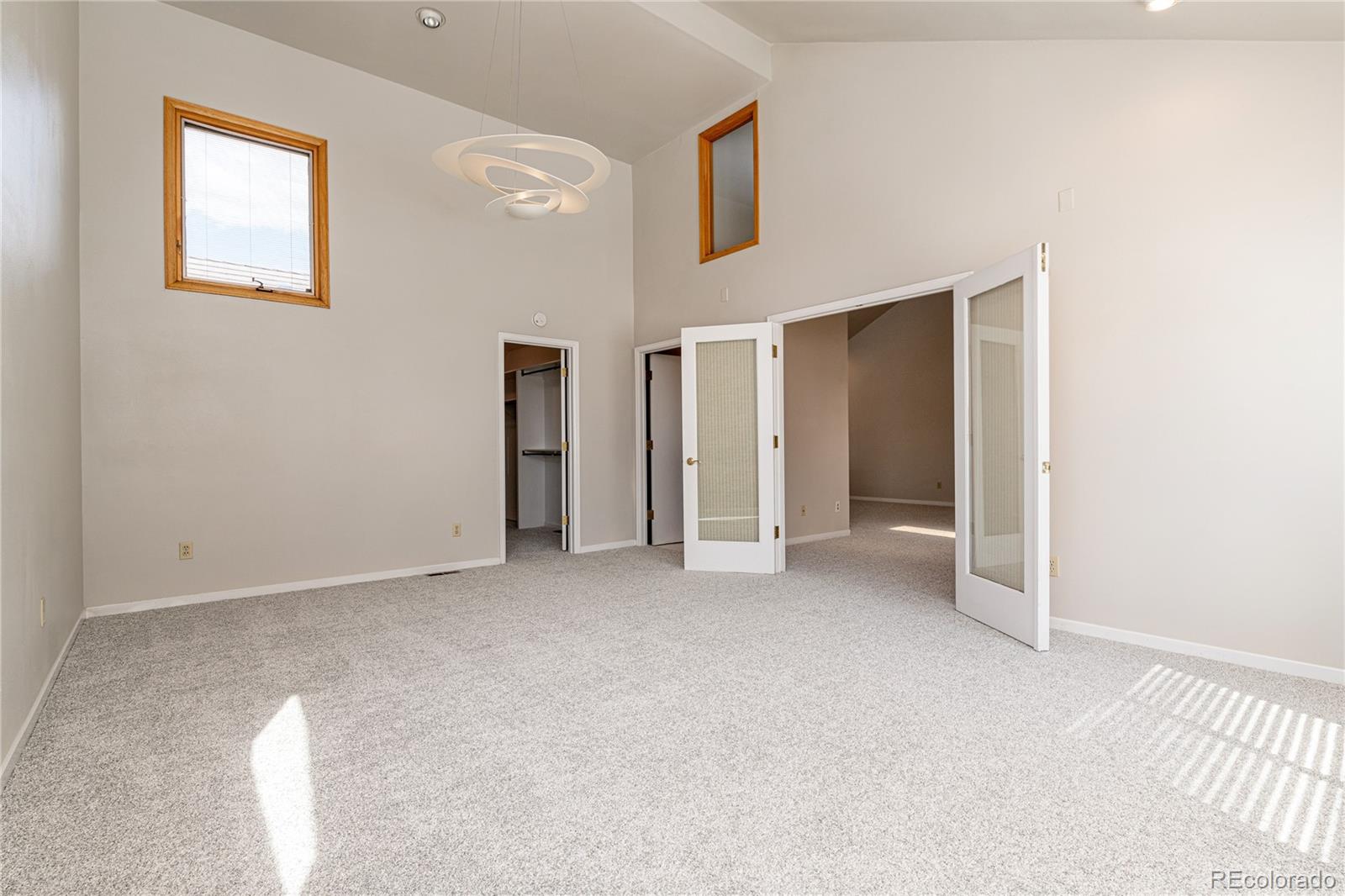 541 Monroe Street, Unit B Denver, CO 80206 - Photo 21 of 37 a view of an empty room with closet and a window