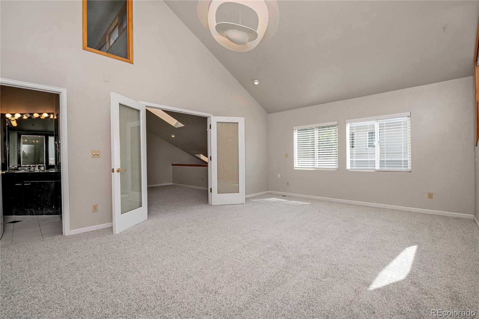 541 Monroe Street, Unit B Denver, CO 80206 - Photo 22 of 37 an empty room with windows and closet