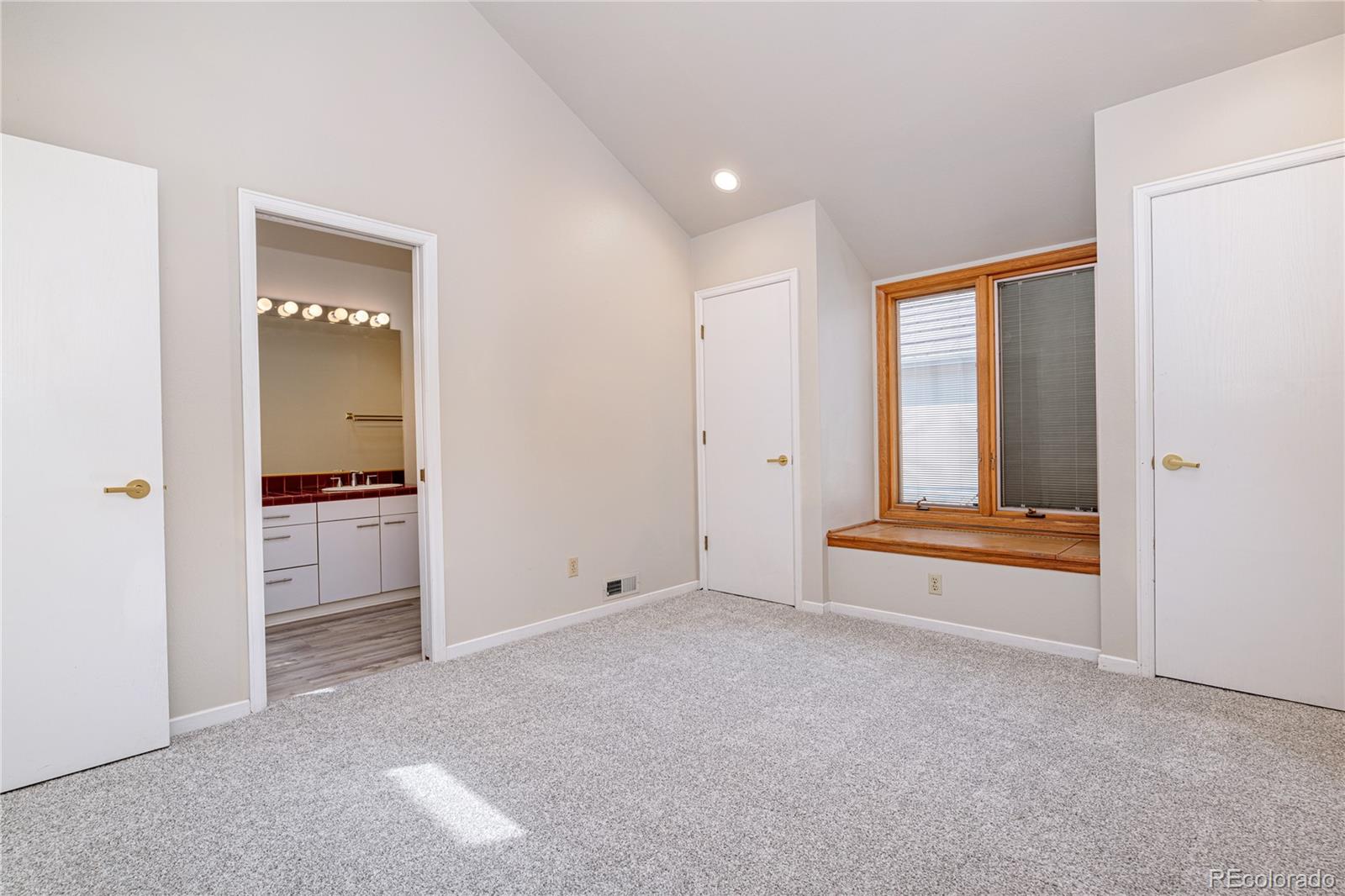 541 Monroe Street, Unit B Denver, CO 80206 - Photo 32 of 37 a view of an empty room with a fireplace and a window