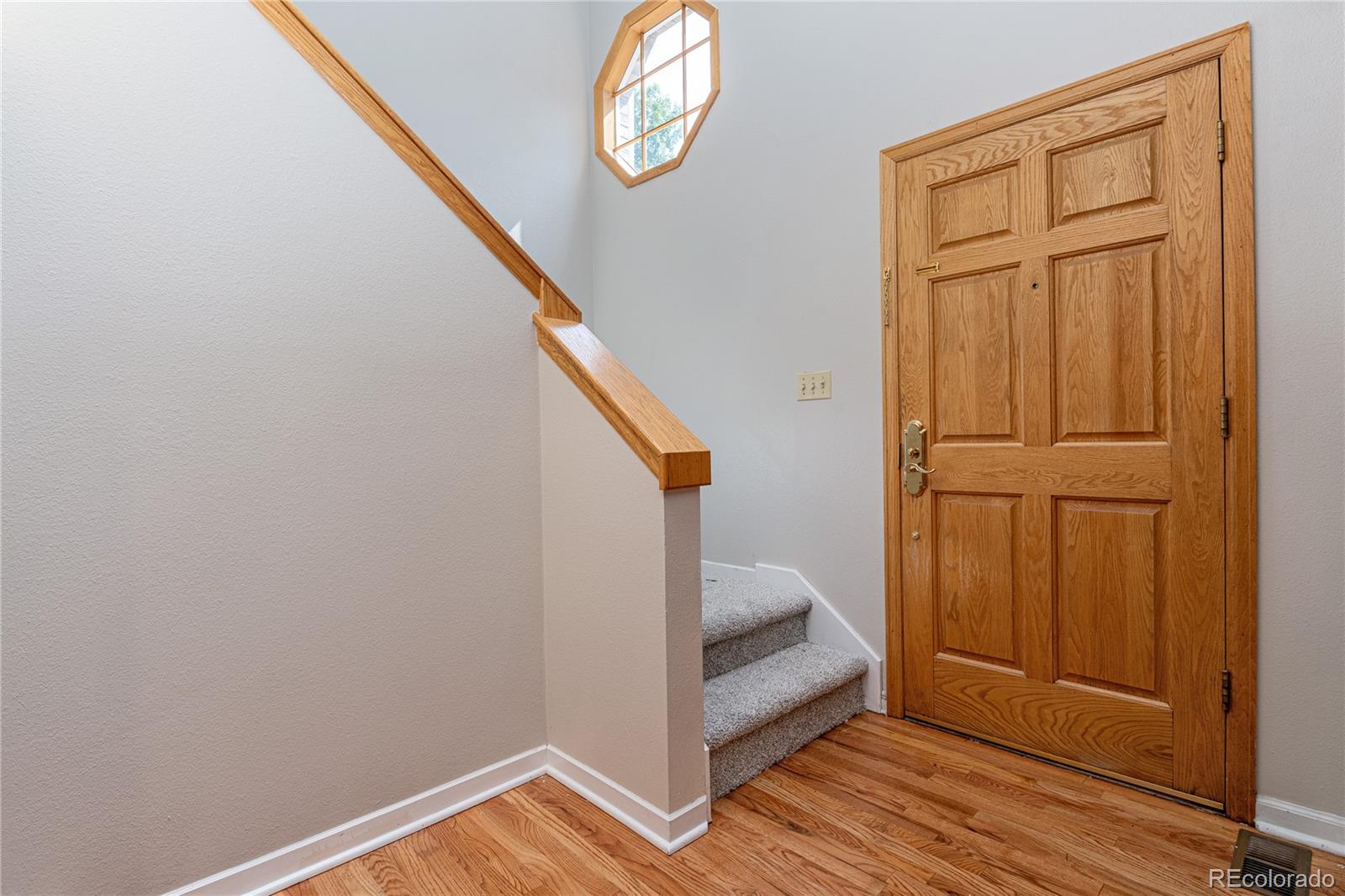 541 Monroe Street, Unit B Denver, CO 80206 - Photo 4 of 37 a view of entryway with wooden floor