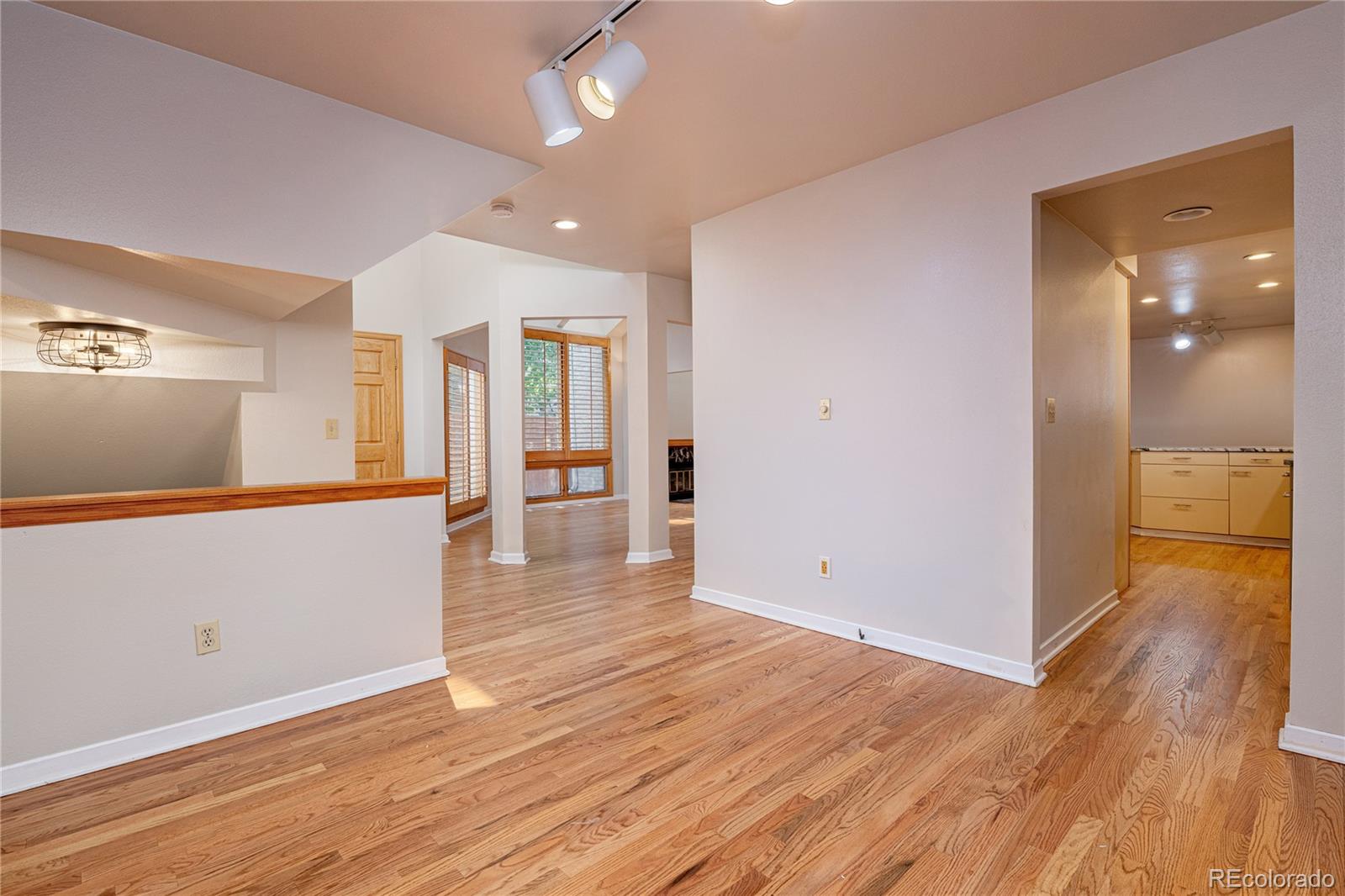 541 Monroe Street, Unit B Denver, CO 80206 - Photo 9 of 37 wooden floor in an empty room with a window