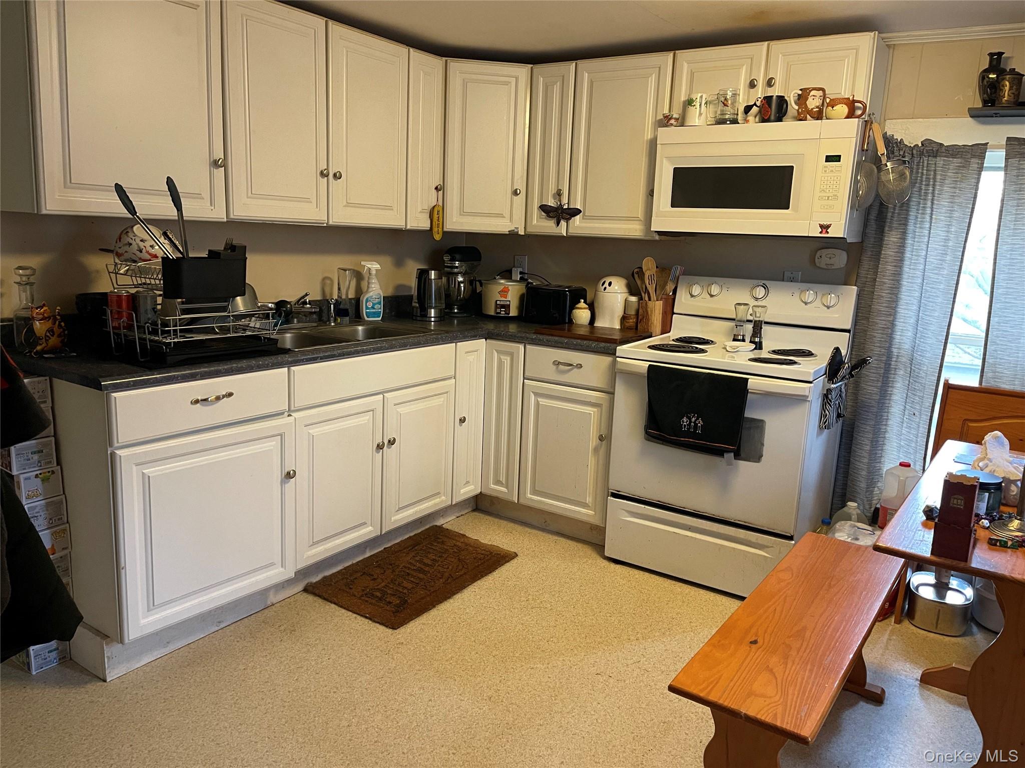 3 Center Street Deposit, NY 13754 - Photo 24 of 45 a kitchen with stainless steel appliances granite countertop a sink a stove a microwave and cabinets