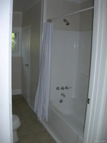 a close view of stove top oven and cabinets