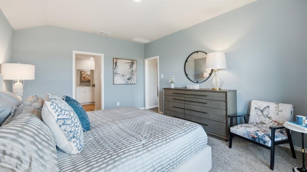 141 MLM Parkway Bridgeport, TX 76426 - Photo 15 of 35 a bedroom with a bed and a chandelier