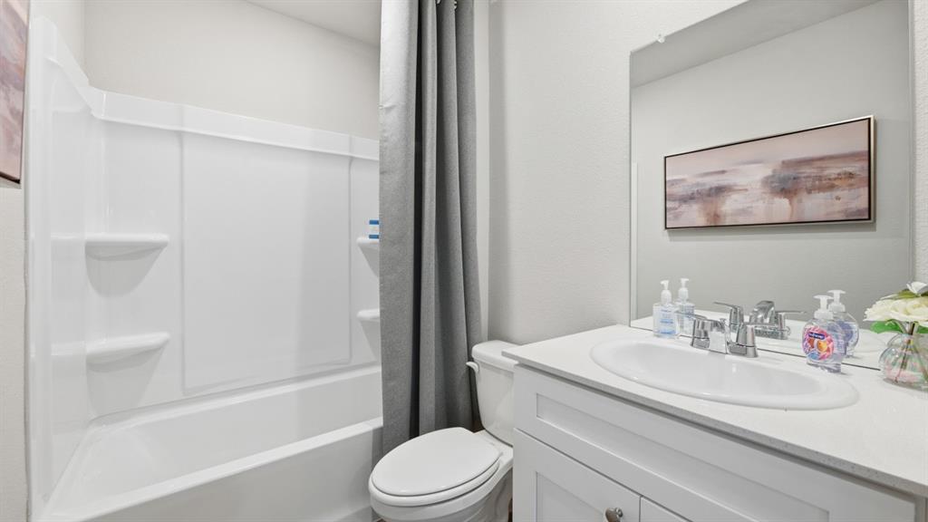141 MLM Parkway Bridgeport, TX 76426 - Photo 24 of 35 a bathroom with a sink toilet and shower