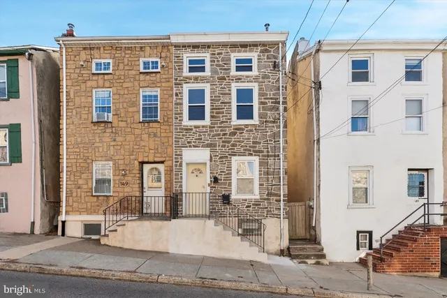 a front view of a building with a street