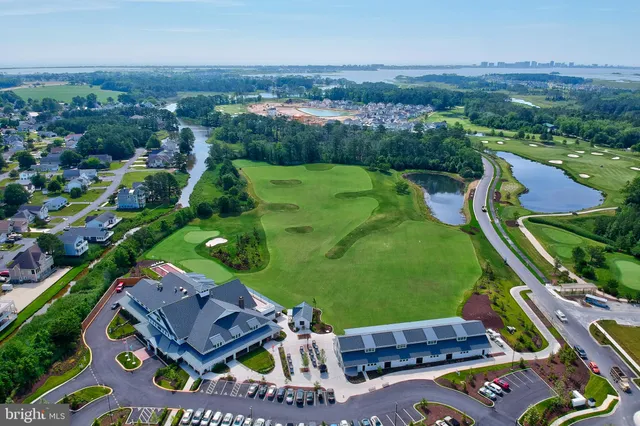 an aerial view of a golf course with parking space