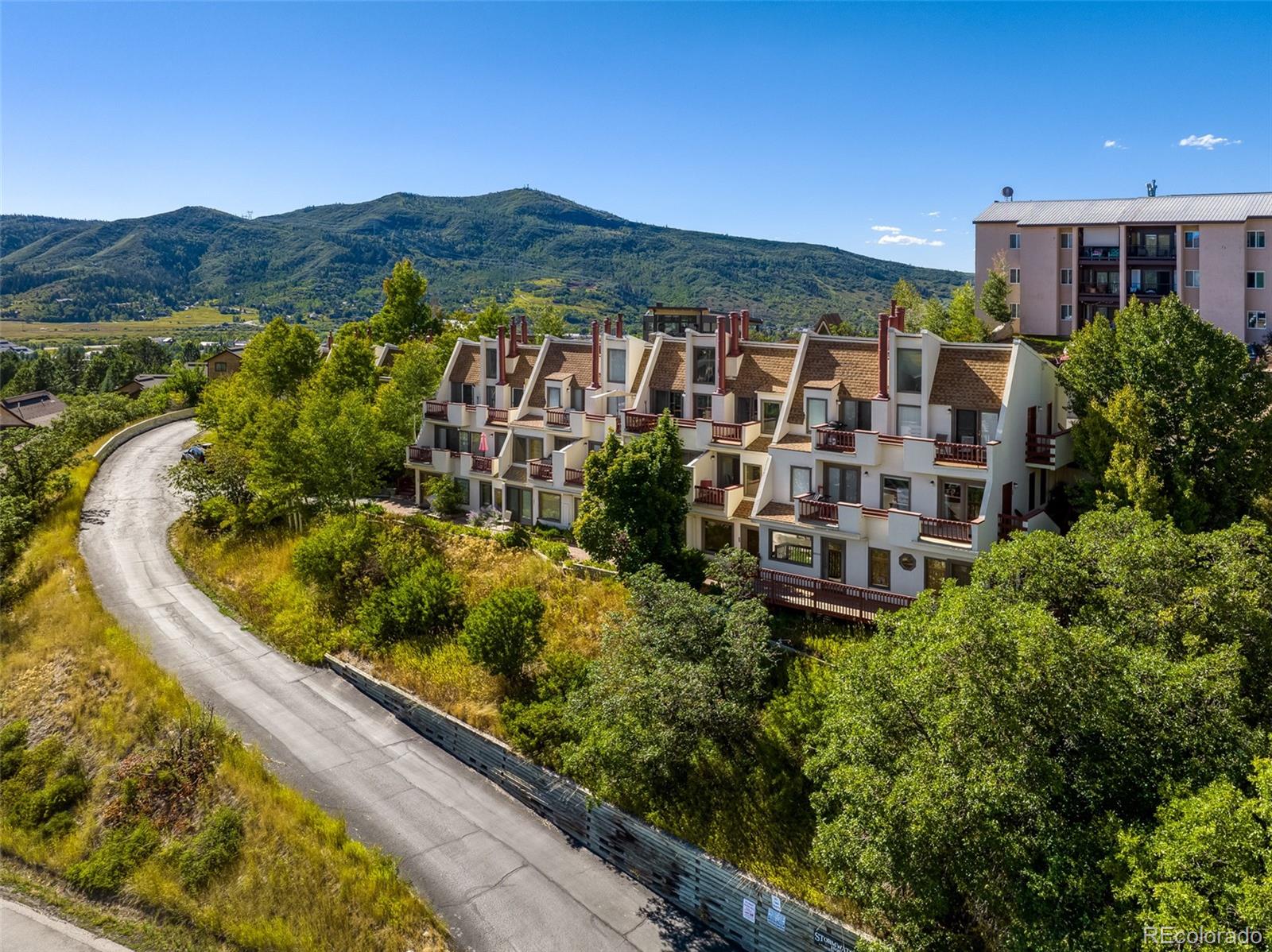 1800 Burgess Creek Road, Unit 205 Steamboat Springs, CO 80487 - Photo 1 of 28 a view of a city with tall buildings