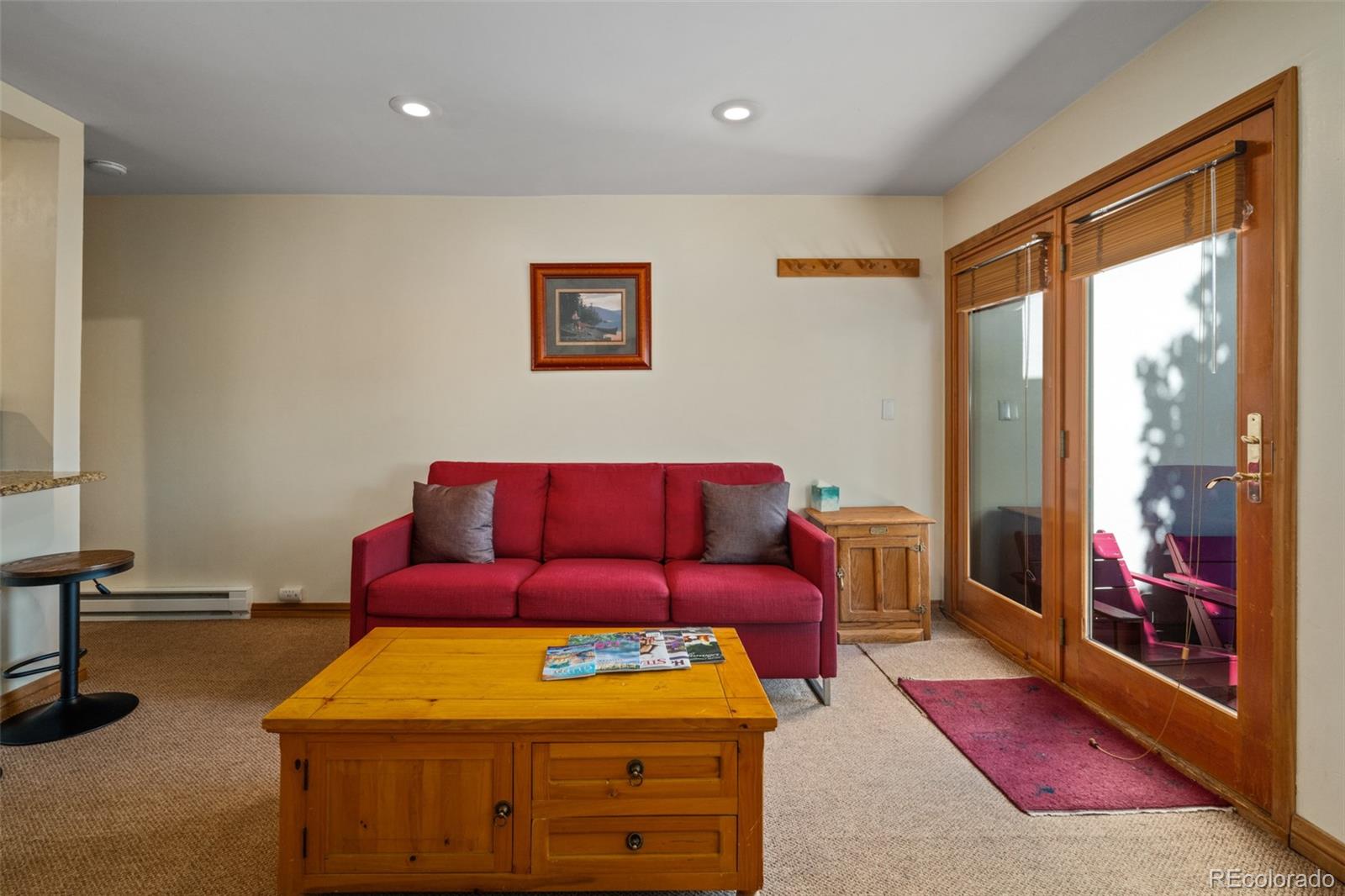 1800 Burgess Creek Road, Unit 205 Steamboat Springs, CO 80487 - Photo 12 of 28 a bedroom with a bed and a large window