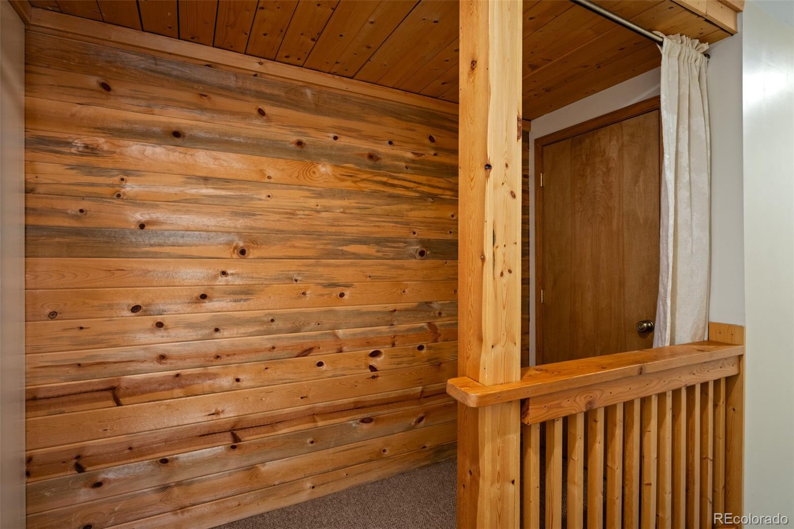 1800 Burgess Creek Road, Unit 205 Steamboat Springs, CO 80487 - Photo 19 of 28 a view of a wooden door